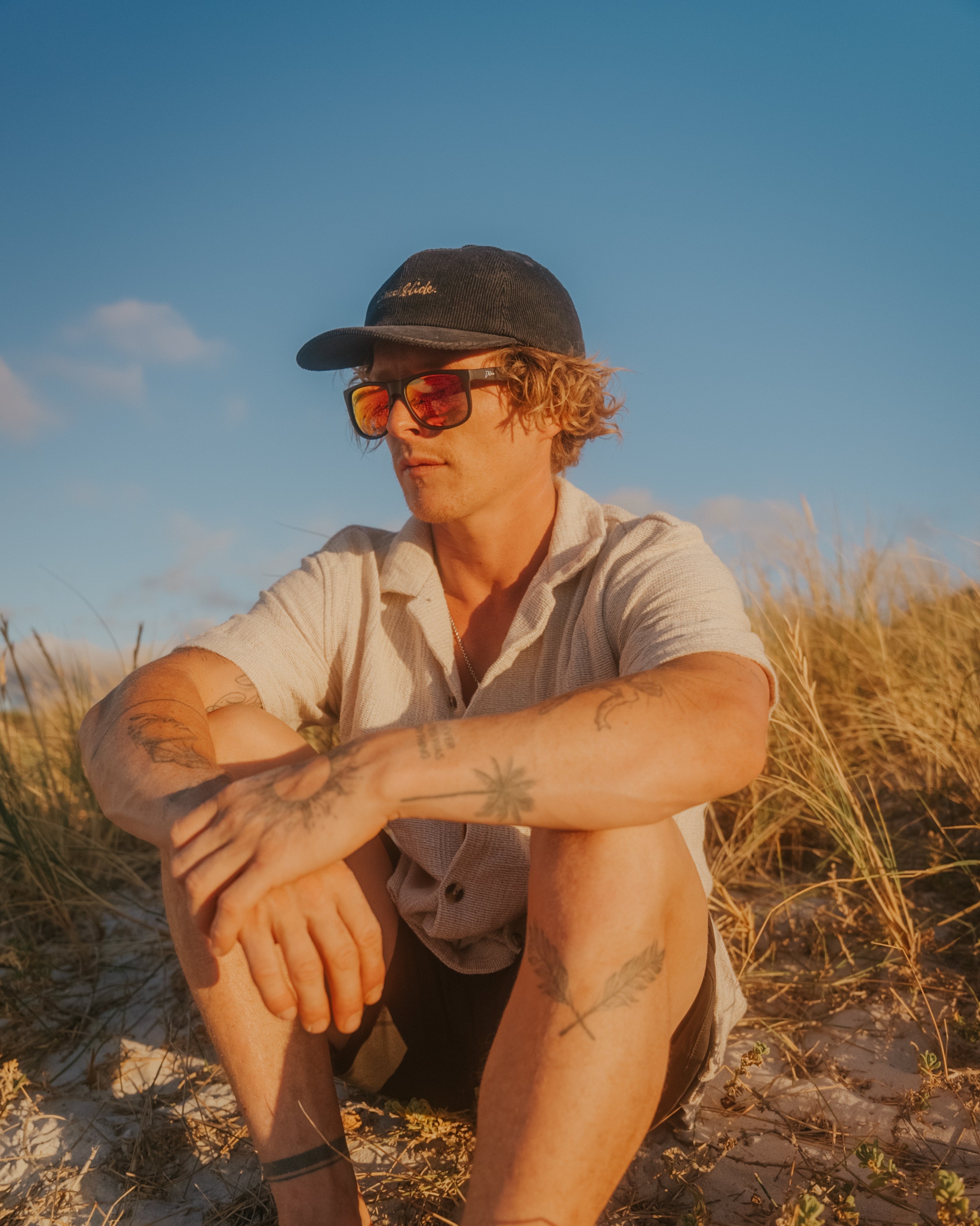 Snowboarder carving through powder in snowy terrain.