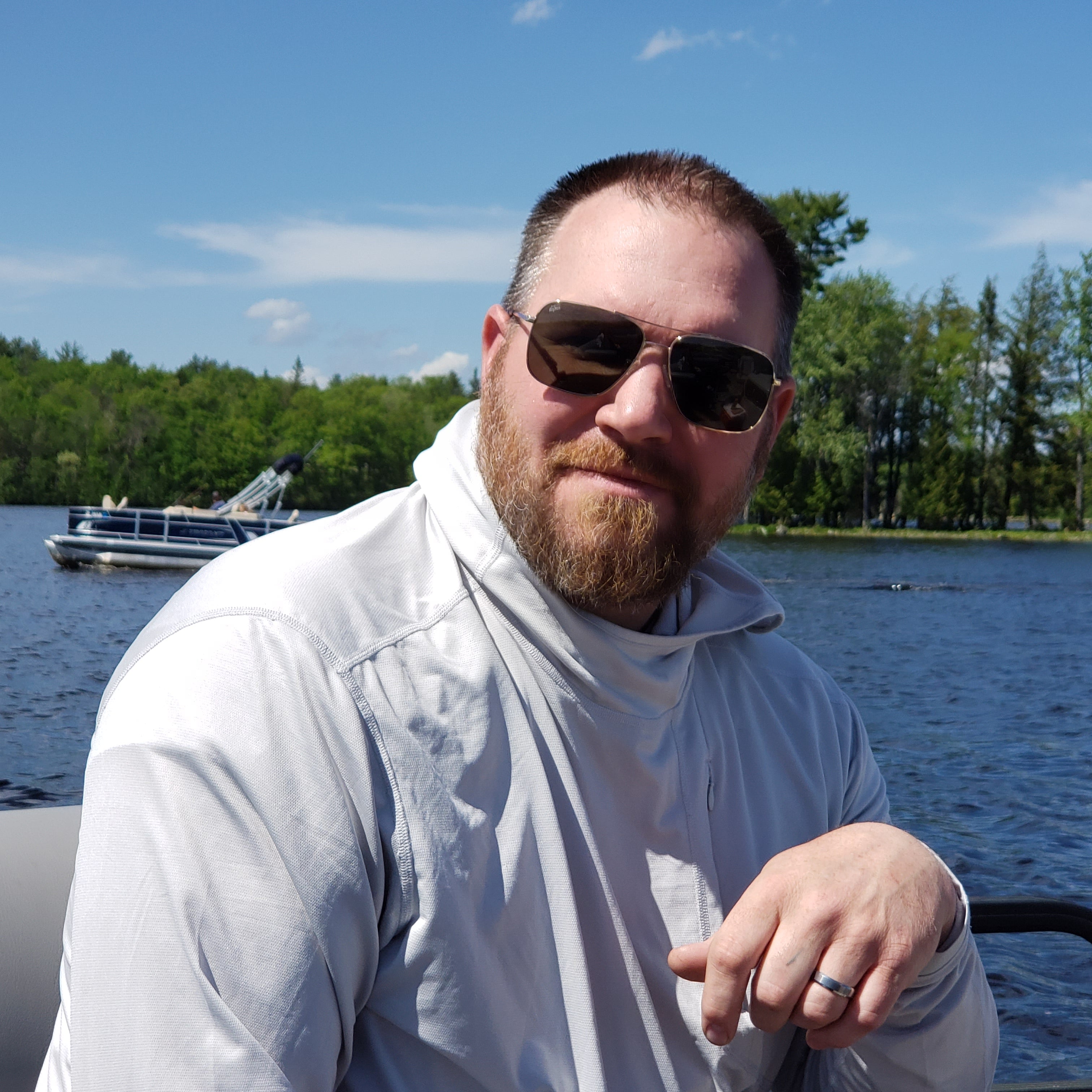 Snowboarder carving through powder in snowy terrain.