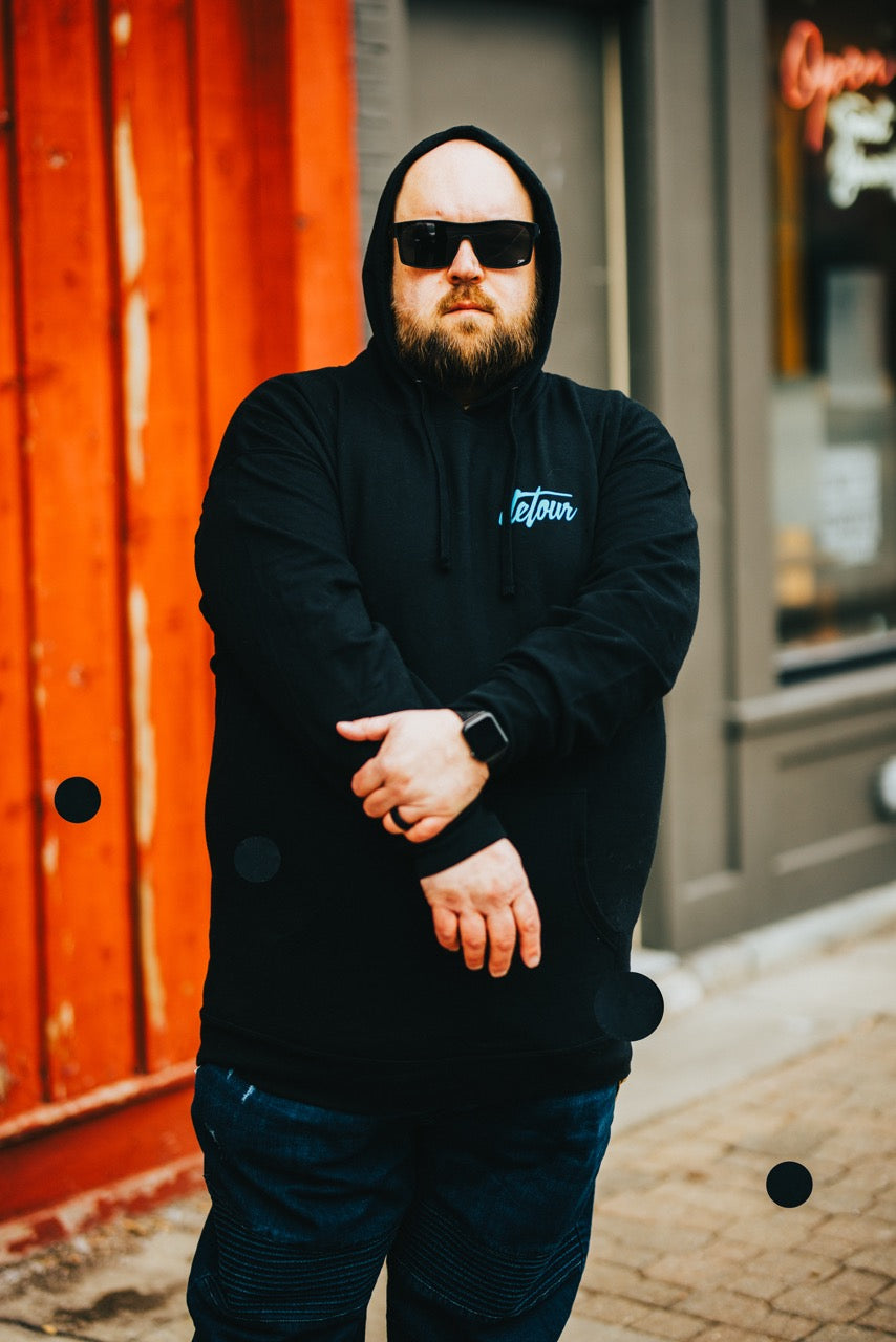 Snowboarder carving through powder in snowy terrain.